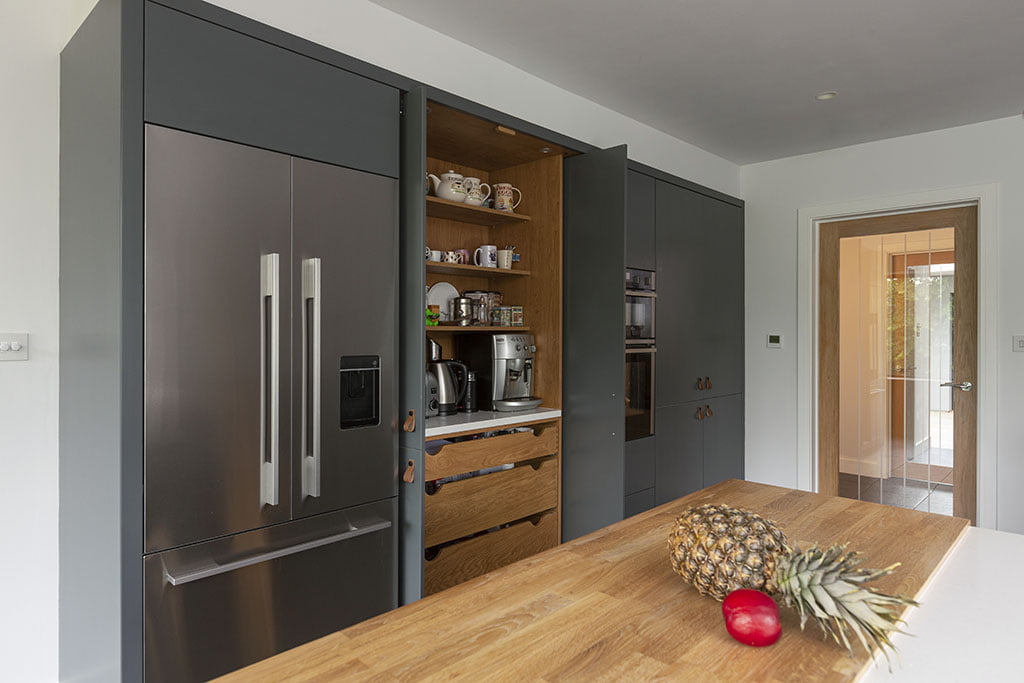 Marriot Collection contemporary kitchen with pocket doors - Kestrel Kitchens