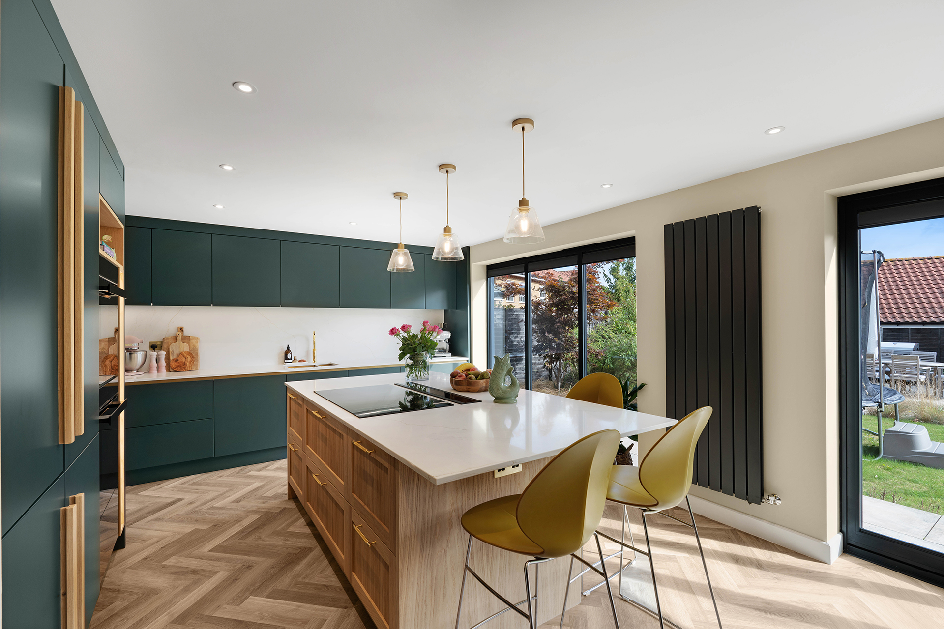 Studio green painted cabinetry from Kestrel Kitchens